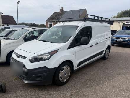 A white van on the busy Cross Street Garage forecourt